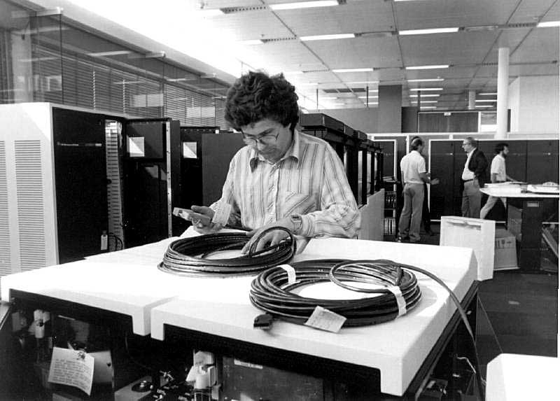 General view of system_X, with Pierre Orcel (our System_X operator) in front, putting some label on cable before installation, 